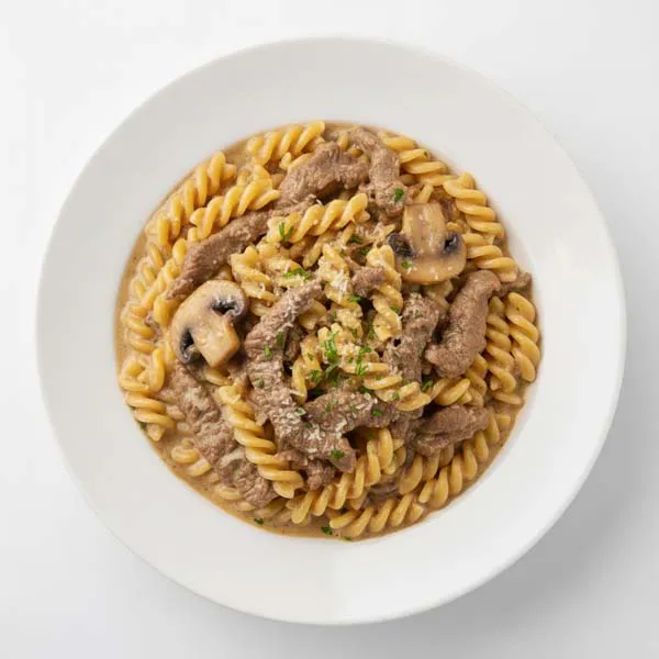 Tender Beef In Garlic Mushroom Sauce With Fusilli Pasta